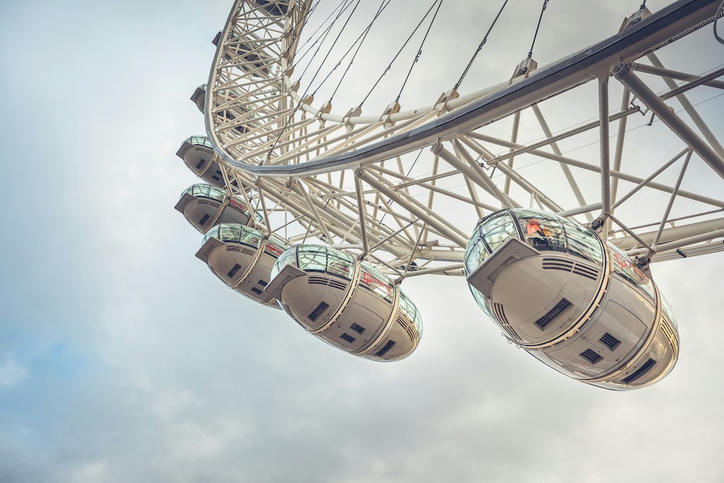 Passengers enjoy a leisurely ride in a comfortable London Eye capsule, taking in the stunning sights of the city from high above