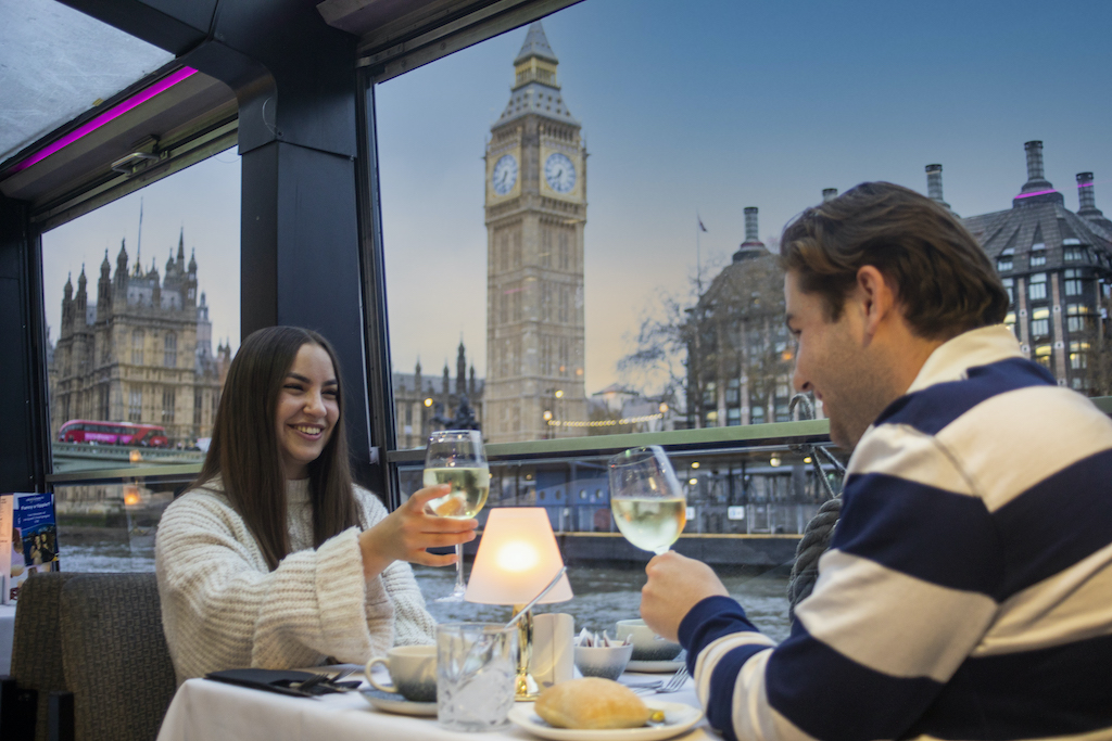 Scenic view of London landmarks from a boat on the River Thames